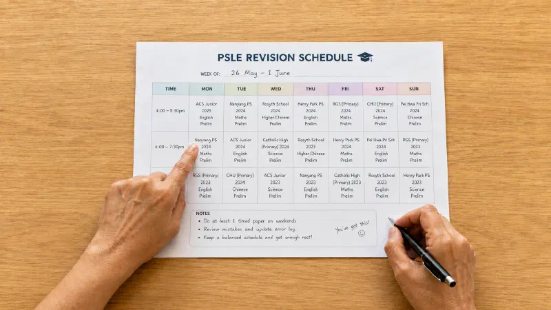 Parent planning PSLE schedule for her child.